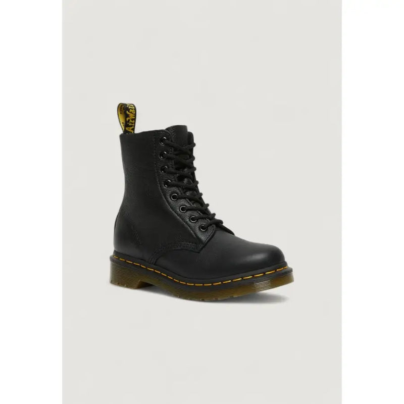 Black leather dr martens women’s fall winter boots shown from the back side highlighting the heel tab