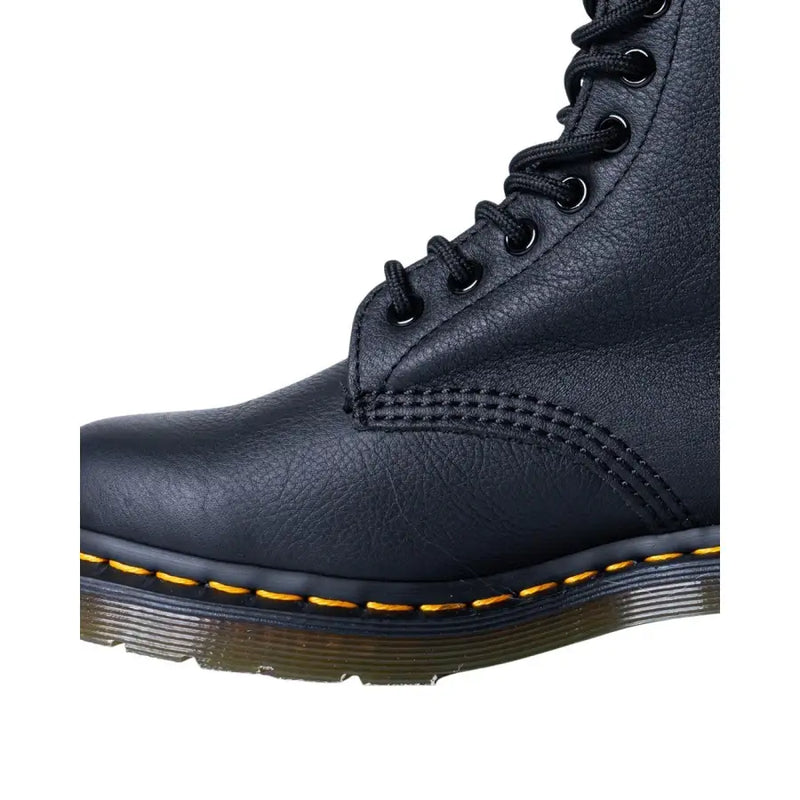 Black leather dr martens women’s fall winter boots shown from the back side featuring sturdy sole and stitching details