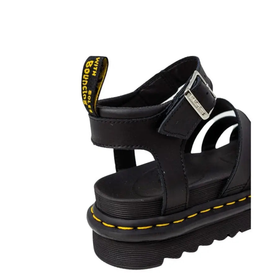 
                      
                        Stylish Dr. Martens black sandals for women displayed in product image
                      
                    