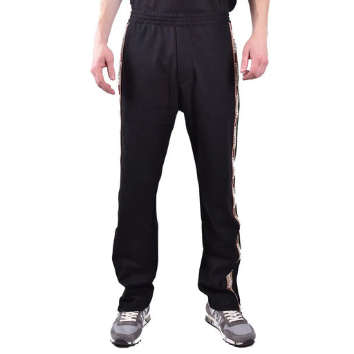 Dsquared Schwarze Herren-Trainingshose aus Baumwollmischgewebe mit strukturiertem Seitenstreifen, verziert mit sich wiederholenden Schriftzügen und Logodetails.