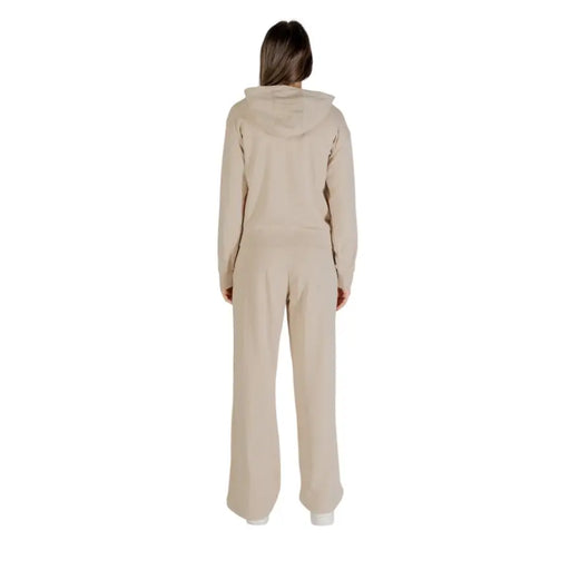 Women’s beige hooded cotton elastane jumpsuit with front pockets and zip closure