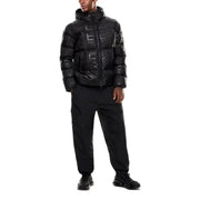 Black quilted puffer jacket with reflective details and hood, likely from a high-end brand like moncler or yves salomon.