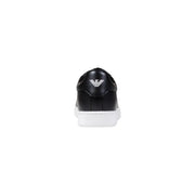Ea7 black leather mens sneakers with white sole showing back side with silver emporio armani logo on heel