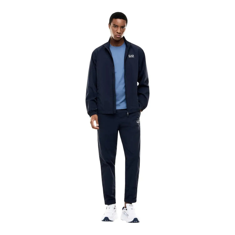 Navy blue ea7 track suit jacket with white logo detailing paired with a light blue short sleeve cotton t shirt for men