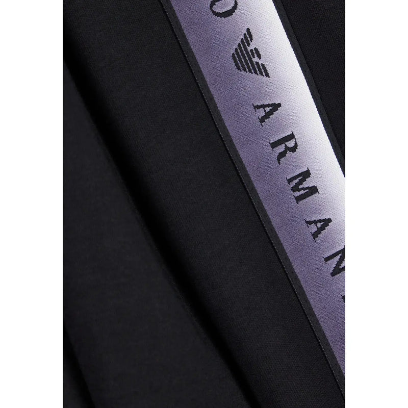 Ea7 Schwarzer Damen-Jumpsuit aus Baumwollmischgewebe mit lila-silbernen Farbverlaufsstreifen und Emporio Armani-Logo in schwarzen Buchstaben