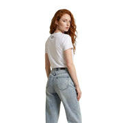 Back view of ea7 women white cotton short-sleeved t shirt with small black logo and round neck design