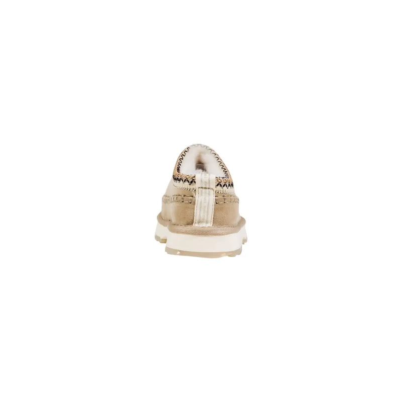 Emu Australia women leather slippers in beige suede with white rubber sole and decorative stitching along the collar