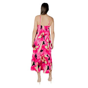 A vibrant fuchsia floral v-neck maxi dress with thin straps and tiered layers perfect for summer occasions