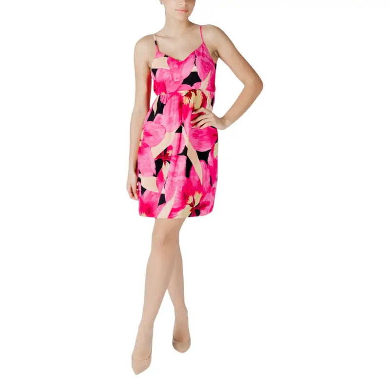 A vibrant fuchsia floral mini dress with thin spaghetti straps and fitted waist perfect for summer wear