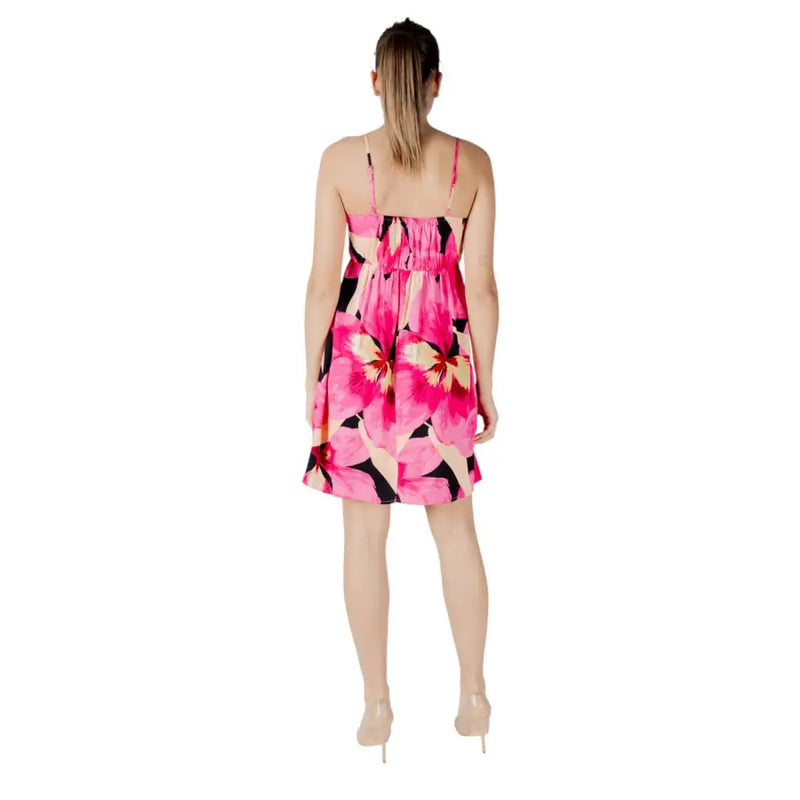 A vibrant fuchsia floral v-neck dress with thin straps and a gathered waist perfect for summer occasions