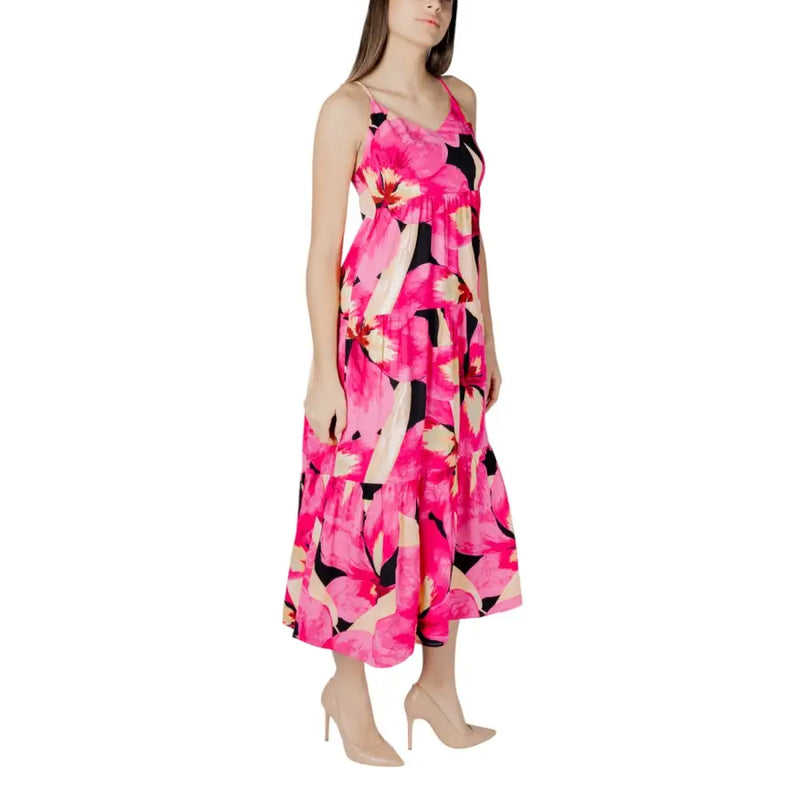 Fuchsia floral v-neck maxi dress with thin straps black and cream accents and a tiered skirt for elegant occasions