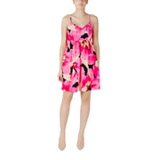 A vibrant fuchsia floral v neck sundress with thin spaghetti straps and a fitted waist for casual wear