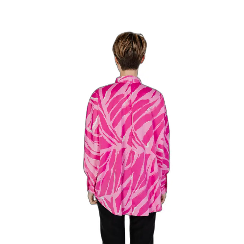 Fuchsia women’s long button-down shirt with vibrant pink and white abstract leaf pattern for spring and summer wear