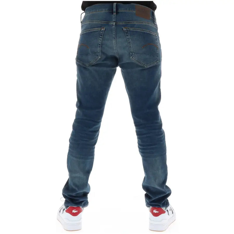 Dunkelblaue G-Star Herrenjeans, Slim Fit, mit Knopfleiste, aus Baumwollstretch, von hinten gesehen, mit braunen Lederapplikationen