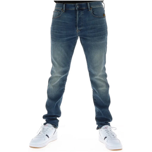 Back side of g-star men jeans 51001 featuring dark-wash slim fit denim with button fly cotton stretch and brown brand patch