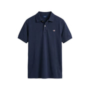 Navy blue Gant men polo shirt with buttoned collar short sleeve cotton pique and small embroidered logo on left chest