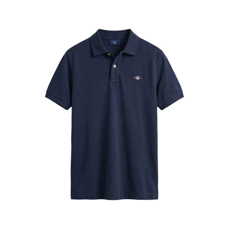 Navy blue Gant men polo shirt with buttoned collar short sleeve cotton pique and small embroidered logo on left chest