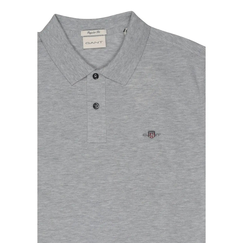 Gray heathered gant men polo shirt with classic collar, button placket, cotton stretch, short sleeve, and embroidered shield logo