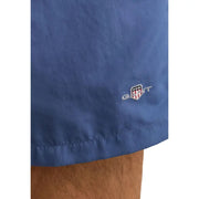 Hellblaue Polyamid-Badeshorts von Blue Gant für Herren mit dezent gesticktem Logo auf der Vorderseite des Stoffes