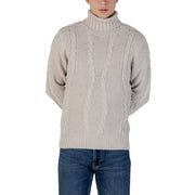 Cream cable knit turtleneck sweater with ribbed detailing and a high neck.