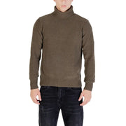 Olive green turtleneck sweater with ribbed texture and cuffs, likely made of wool or cotton blend.
