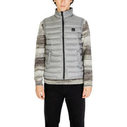 Gianni Lupo grey polyamide sleeveless gilet with quilted design black zipper and logo patch worn over striped sweater