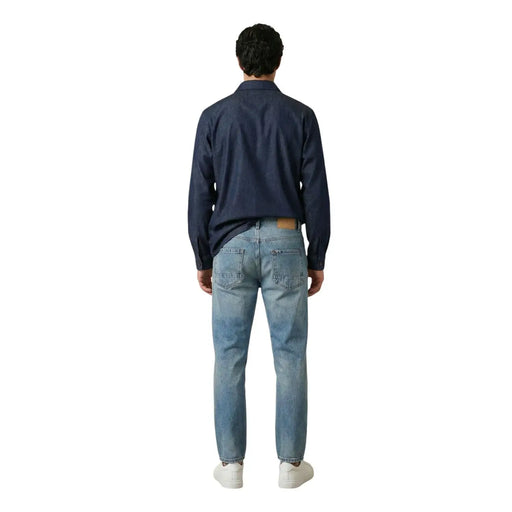 A pair of light-wash denim jeans with classic five-pocket design and subtle fading for men by gianni lupo