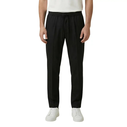 Black drawstring trousers with sleek straight-leg cut and subtle waistband pleats from gianni lupo in polyester viscose