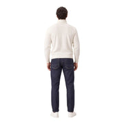 Gianni Lupo Rollkragenpullover für Herren in Creme mit Rippstrickmuster, getragen vom Model mit dunkelblauen Jeans, Vorderansicht