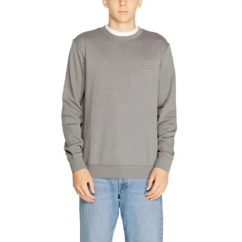 Gray crewneck sweatshirt modeled by a person from Boss Men Knitwear