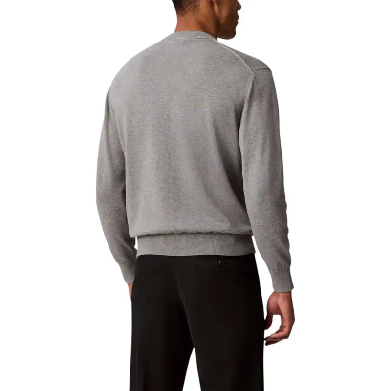 Mens gray long-sleeved sweater paired with black pants, suitable for casual wear