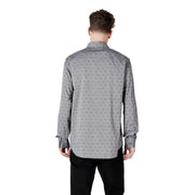 Gray patterned men’s long sleeved shirt with a subtle repeating pattern of small dark motifs on button-down fabric