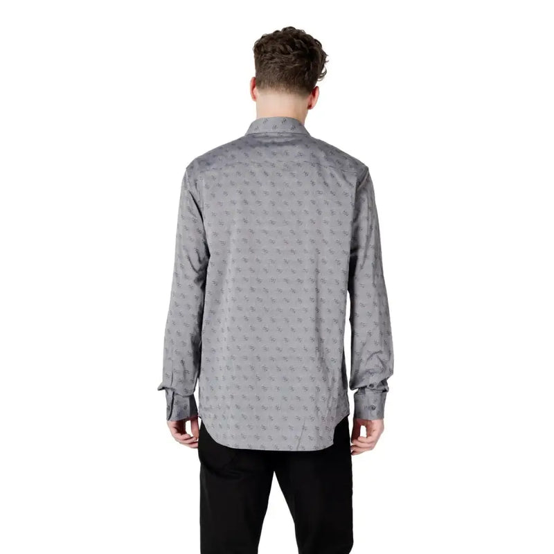 Gray patterned men’s long sleeved shirt with a subtle repeating pattern of small dark motifs on button-down fabric