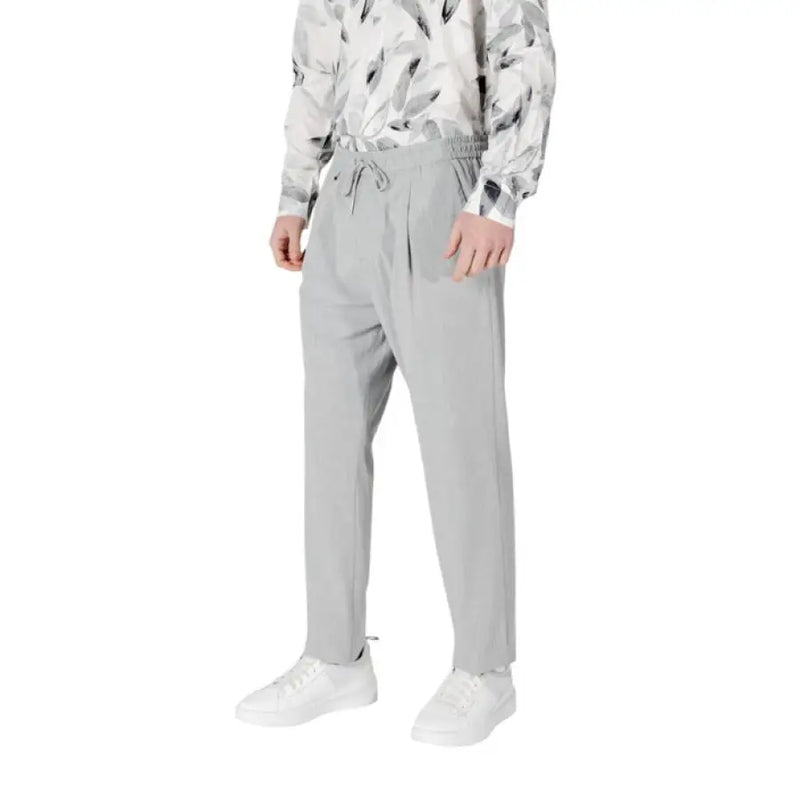 Gray drawstring trousers displayed in a fashion retail setting highlighting comfort and style