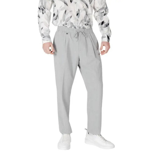 Gray drawstring trousers displayed in a product image showcasing stylish casual wear