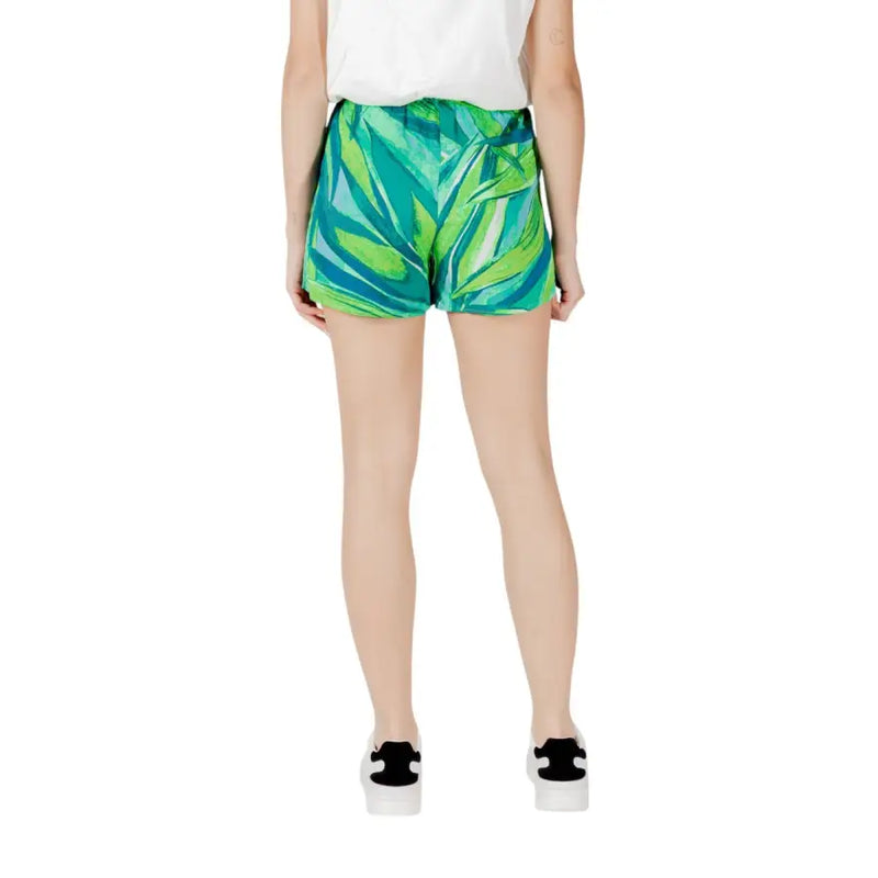 Green floral viscose shorts for women featuring vibrant tropical leaf pattern lightweight flowing fabric with pockets