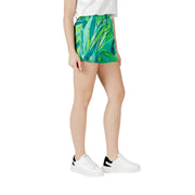 Green floral viscose shorts for women featuring a tropical leaf pattern and a drawstring waist with pockets