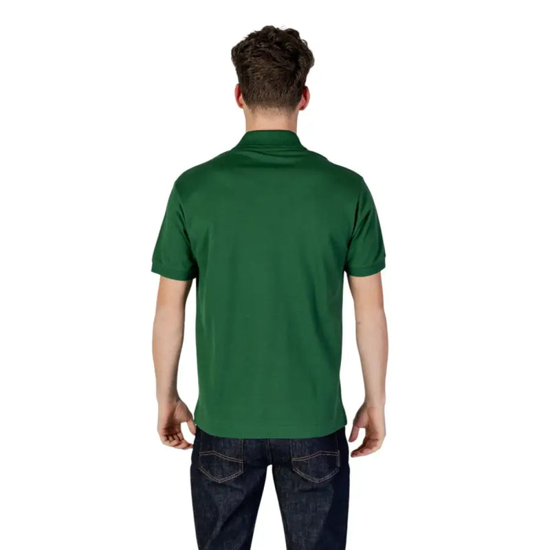 Green Lacoste polo shirt featuring a solid color short sleeves classic collar and neatly stitched seams