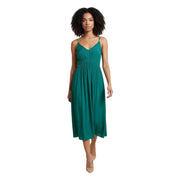 A flowing emerald green v-neck strap dress in polyester with thin spaghetti straps and a gathered waist