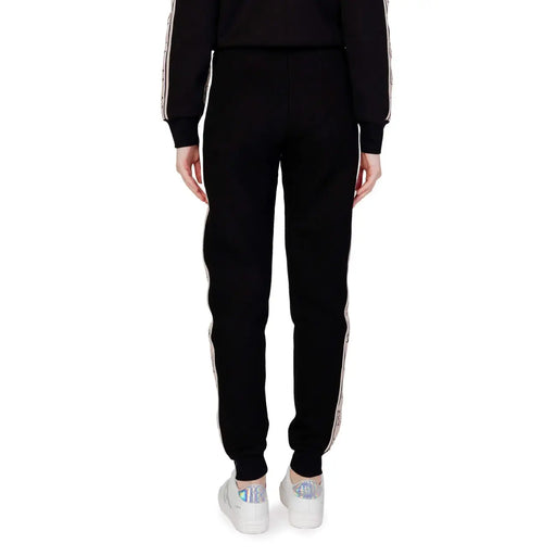 Guess active Schwarze Damen-Jogginghose aus Baumwolle mit weißen Seitenstreifen und dezentem Muster für Herbst und Winter