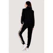 Guess active women’s black zip sweatshirt with pink and white patterned side stripes made of 100% cotton