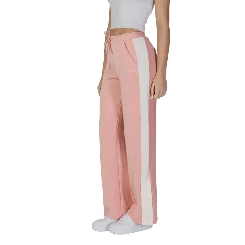 Guess Active women’s pink and white wide-leg sweatpants with side stripes, drawstring waistband, and front pockets