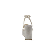 Guess beige espadrille wedge sandals with braided rope heel, ankle strap, buckle, and bow detail