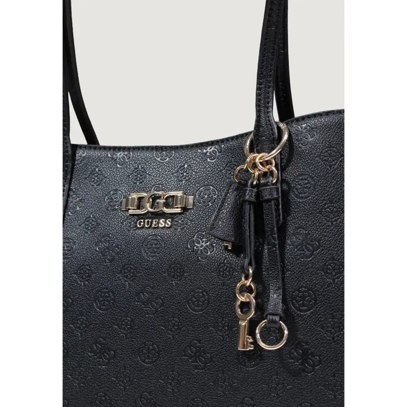 Black Guess polyurethane tote bag with embossed logo pattern and metallic hardware accents featuring multiple pockets