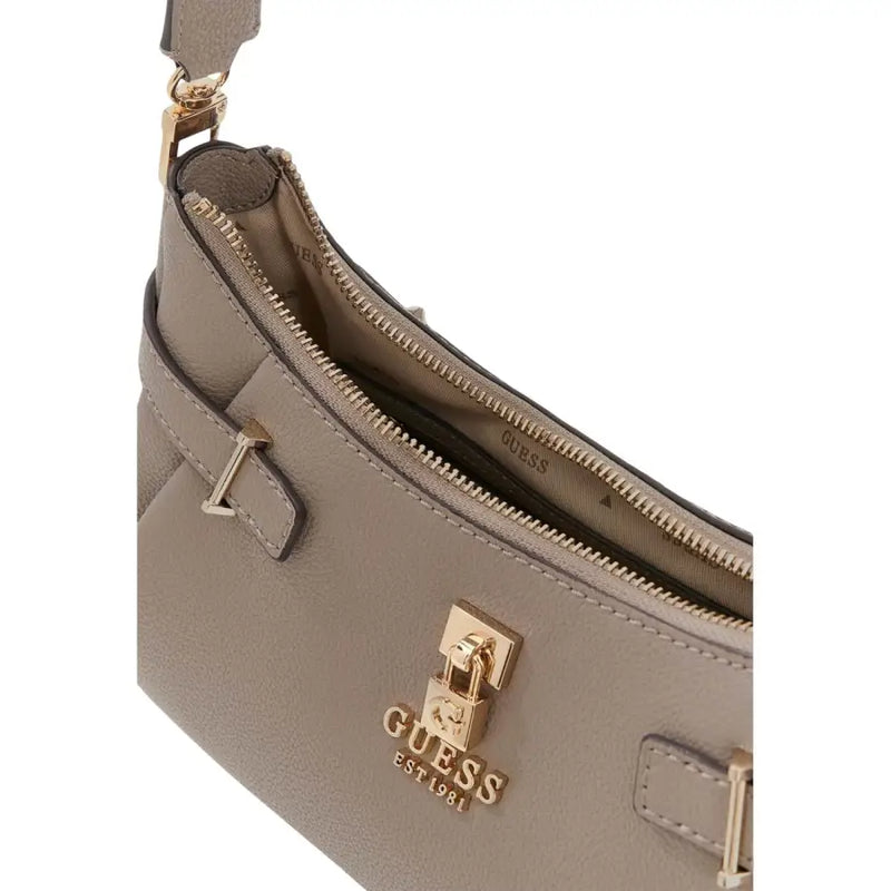 Taupe leather Guess handbag with gold-tone hardware and lock-shaped logo plaque featuring zip closure