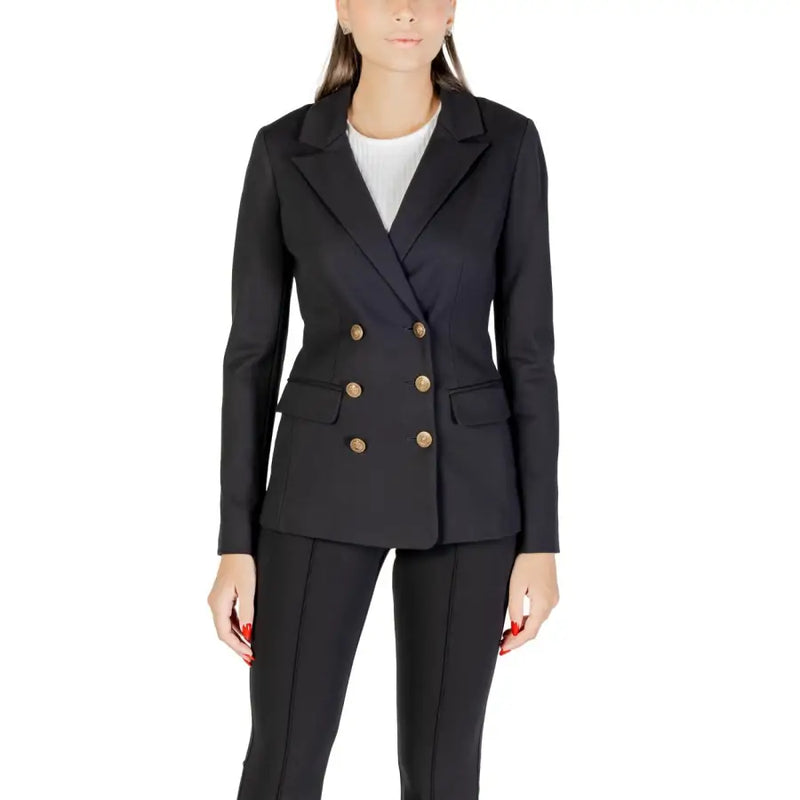 Woman wearing Guess Long Black V Neck Blazer with gold buttons for fall winter fashion