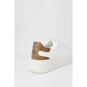 Back side of Guess men’s white leather sneakers with brown monogram patterned heel tab and chunky white sole