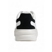 Back side of guess women black faux leather sporty sneaker with white upper black suede heel patch and chunky sole
