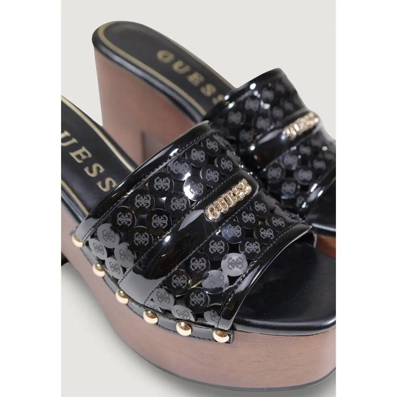 Black glossy Guess women platform slide sandals with wooden block heel, polyurethane straps, and gold hardware embossed logo