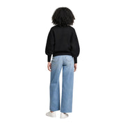 Guess women black sweatshirt logo with viscose blend long sleeves and puffy sleeves paired with light-wash wide-leg jeans